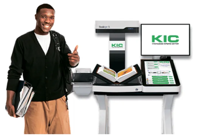 A student giving a thumbs-up beside a KIC self-serve digitization station