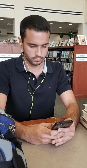 A student listening to ReadAlong Audio